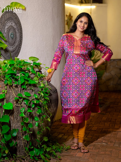 Gorgeous Purple Patola Print Kurti with Silk Zari Border